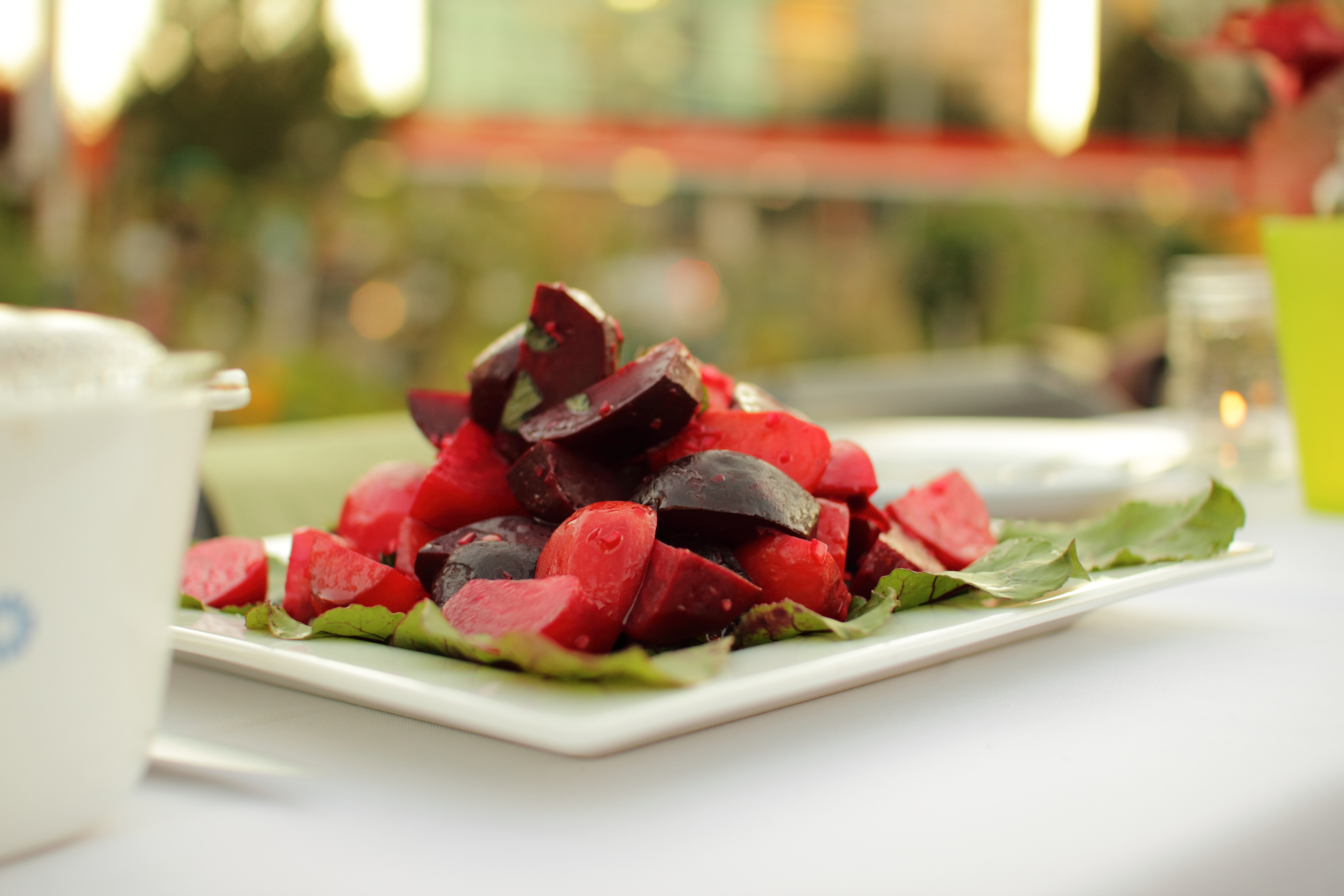 Photoreal photograph of the finished dish Beet salad (Salata), the actual plate from Lesotho, handmade ceramic, natural window light, shallow depth of field, no text, no logo, no people, Natural window light, ivory linen, handmade ceramic, shallow depth of field, no text, no logo, no watermark, fine-dining magazine photograph. Beet salad