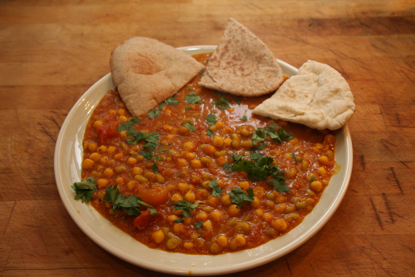 Photoreal photograph of the finished dish Red lentil curry (පරිප්පු), the actual plate from Sri Lanka, handmade ceramic, natural window light, shallow depth of field, no text, no logo, no people, Natural window light, ivory linen, handmade ceramic, shallow depth of field, no text, no logo, no watermark, fine-dining magazine photograph. Red lentil curry